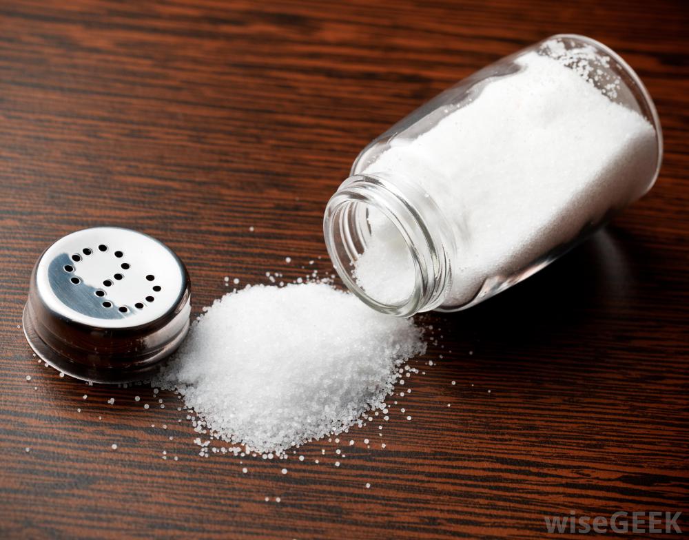 Salt shaker spilled on a table